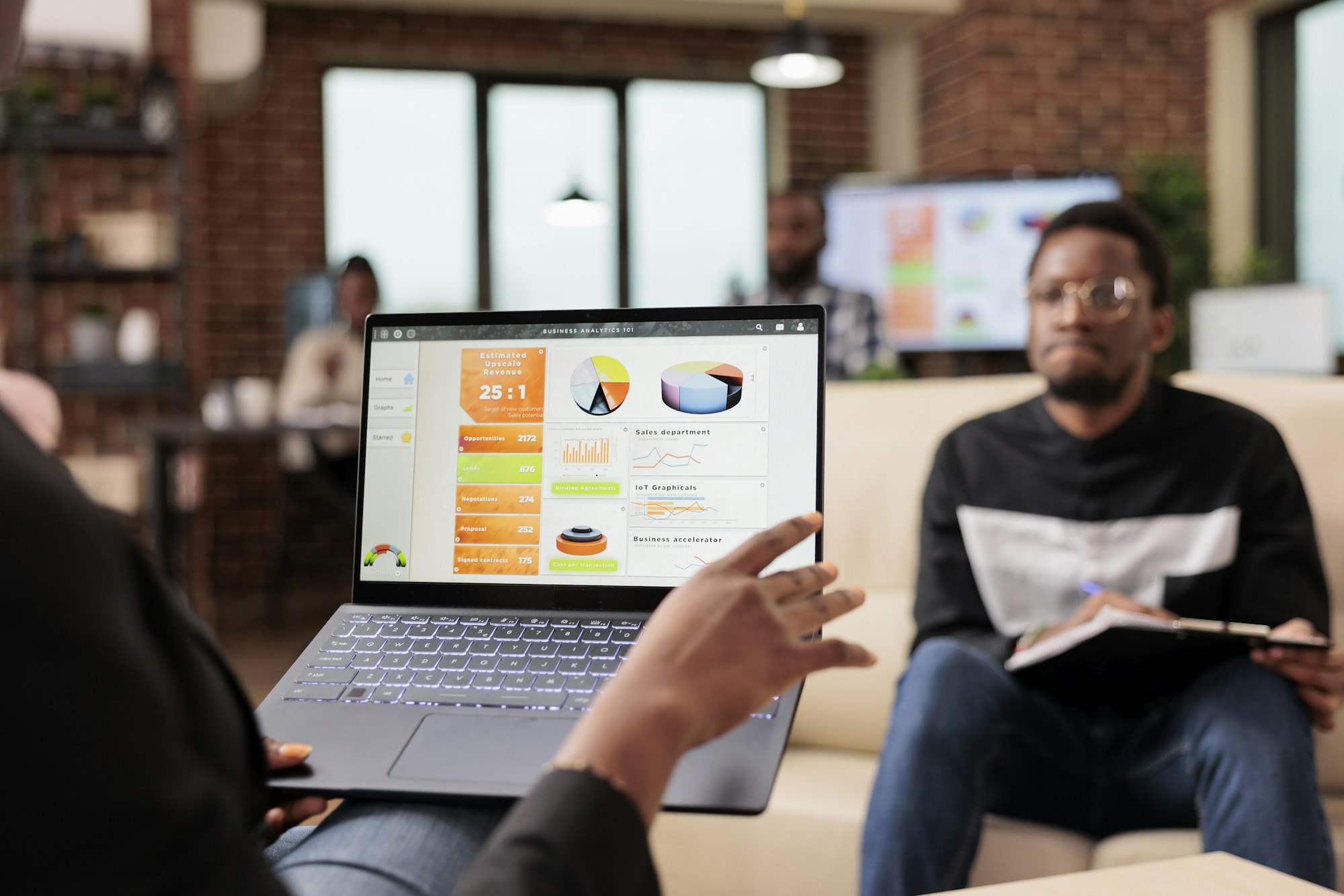 African american business people analyzing company charts